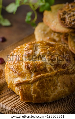Puff pastry stuffed by camembert and berries, delicious food
