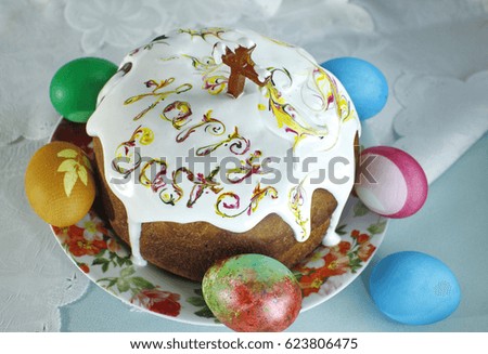 Still life with Nice colorful Easter eggs and traditional Easter cakes with text "Happy Easter"