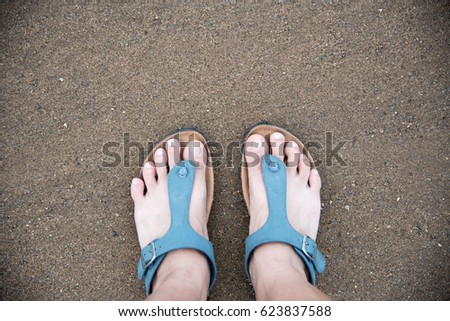 Refreshing feet on the beach sand. relaxation concept. inspiration motivation concept.