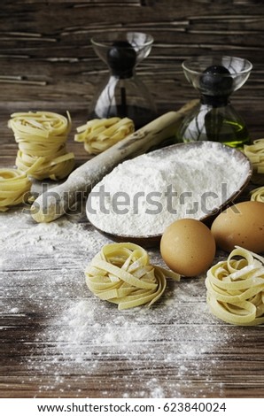 A set of products for cooking pasta with wheat flour, and a ready-to-cook pasta table, a selective focus