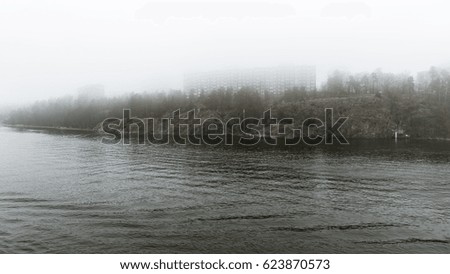Cliffs in Sweden in a very foggy morning. Royalty-Free Stock Photo #623870573