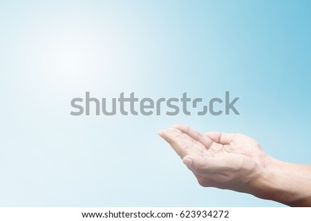 Human hands open palm up to Bless God Helping. Hands folded together repent from Catholic Easter. Christian concept background freedom dream belief future enjoyment earth: Child trust in mercy of God.