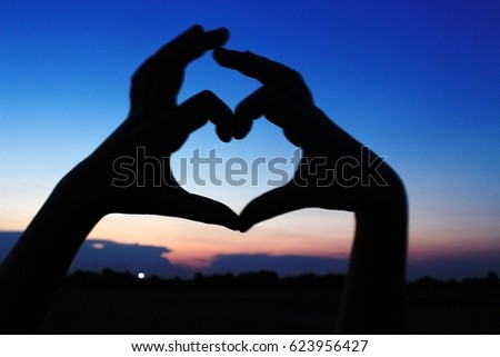 Blur picture of hand signal "Love"