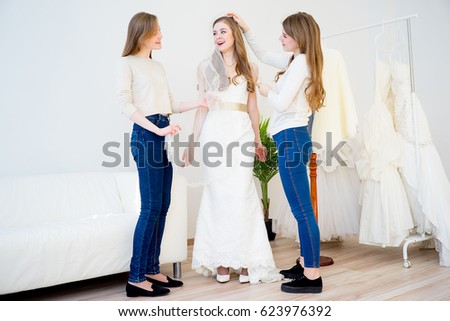 Bride chooses a gown