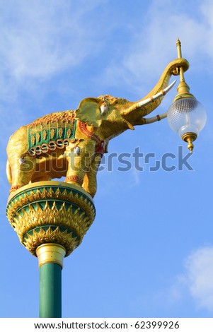 Elephant lamp with a request to the sky background.