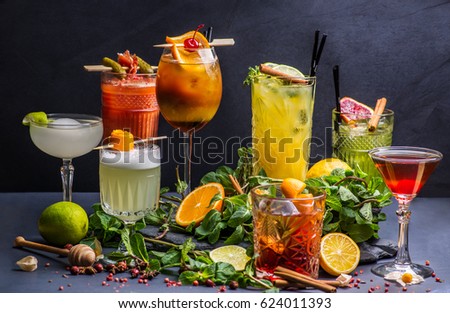 Various cocktails on dark background Royalty-Free Stock Photo #624011393