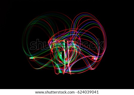 abstract neon light painting on black background.