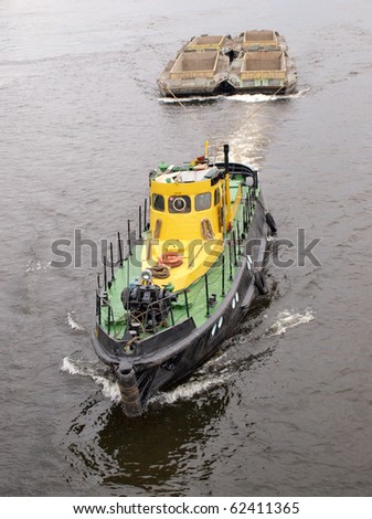 Color photograph of a large river tug on water