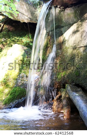 a small waterfall in the park
