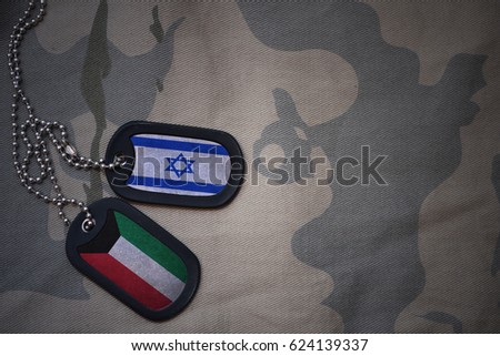 army blank, dog tag with flag of israel and kuwait on the khaki texture background. military concept