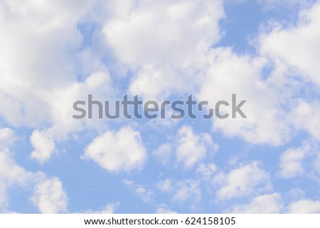White fluffy clouds in  blue sky and copyspace for backgrounds