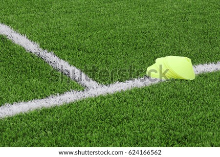Chips on an artificial lawn with markings on a football field. Sports background.