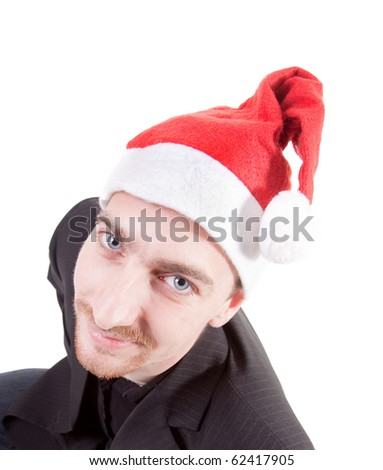 young businessman wearing santa hat