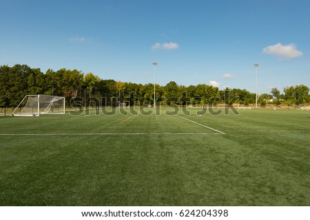 Background of a public park soccer field from the sideline angle with a shallow depth of field