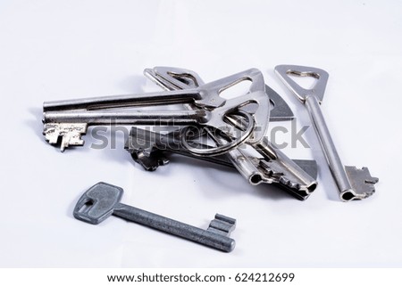 A bunch of old keys isolated on white background