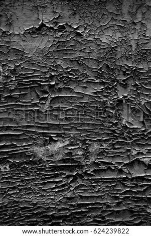 Wall texture background with peeling old paint. Image includes a effect the black and white tones.