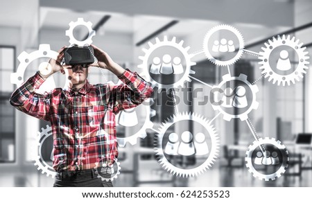 Young man with virtual reality headset or 3d glasses over social connection background