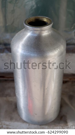 Old aluminum flask bottle