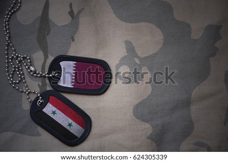 army blank, dog tag with flag of qatar and syria on the khaki texture background. military concept