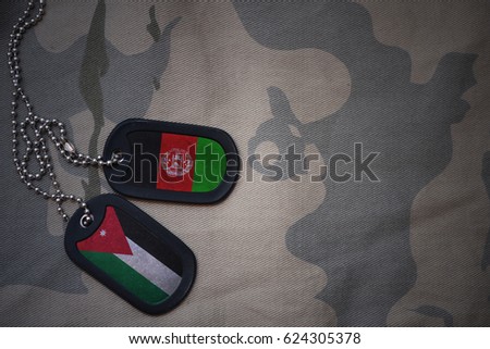 army blank, dog tag with flag of jordan and afghanistan on the khaki texture background. military concept