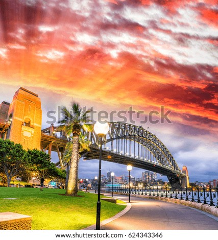 Beautiful view of Sydney Harbour Bridge with sunset sky, Australia.