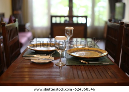 Dining table is prepared to wait for guests.