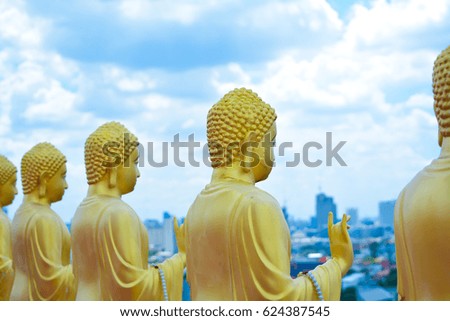 Buddha statue and city and sky.