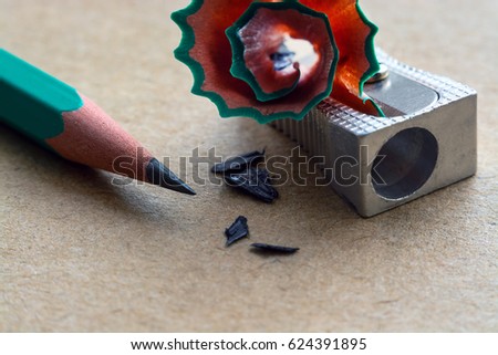 sharpener for pencils on craft paper with traces of pencil