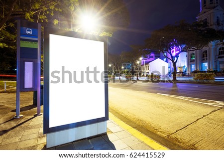 night scene of empty light box on street in modern city