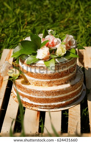 Tasty summer cake on wooden ground