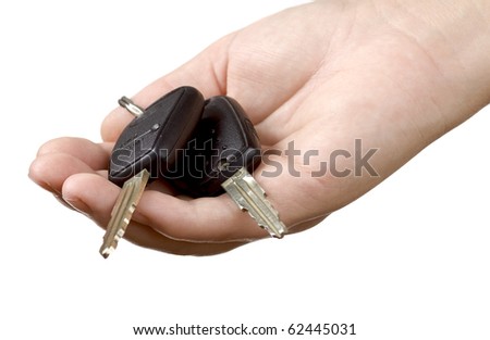 Hand holding car keys isolated on white background