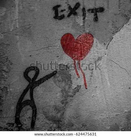 Graffiti with boy losing heart  lost love  in the picture there is a florence graffiti where a boy loses his heart