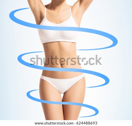 Close-up of thin and beautiful female body. Weight loss, sports, exercising, water balance, healthy nutrition concept. Cyan arrows.