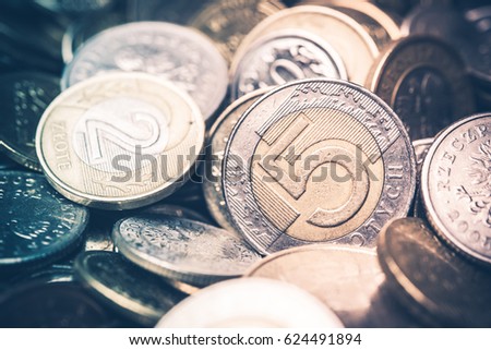 Polish Currency Coins. Five and Two Zloty Coins Closeup Photo. Warm colors.