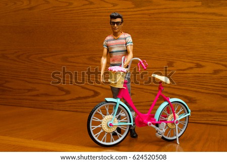 Doll with a bicycle