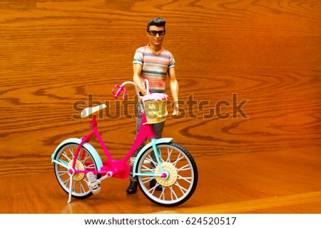 Doll man with a bicycle
