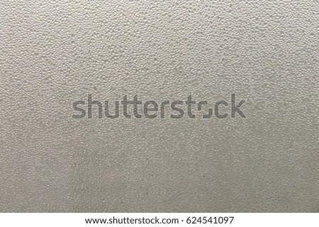 Abstract texture of blurry water drops on glass