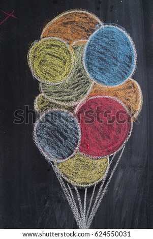 Graphic representation of colored balloons drawn with chalk on blackboard