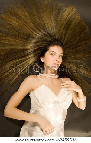 portrait of beautiful young woman with luxuriant healthy long hair