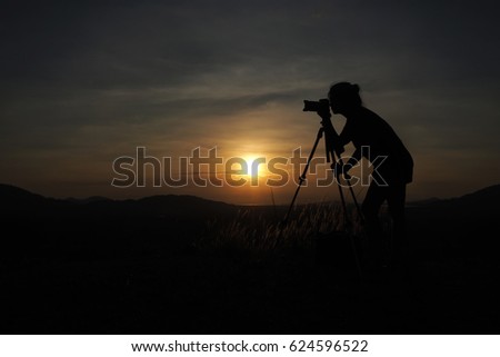 Photographer silhouette and sunset