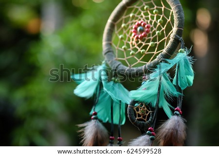 Soft focus and blurred Dream Catcher Blue Coral with natural background in vintage style. boho chic, ethnic amulet.