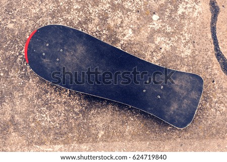 Top view of skate board on concrete floor