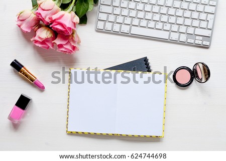 Woman desk with accessories and flowers