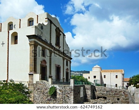 Italy,Calabria-archeological finds from the Greek-Roman era in the Castello van Lipari, with the Chiesa di Santa Caterina in the background