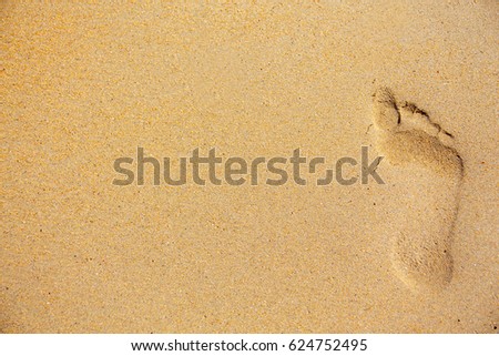 Vacation concept. trail foot, footprint on the sand