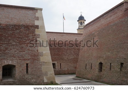 Fortress walls and church in the background