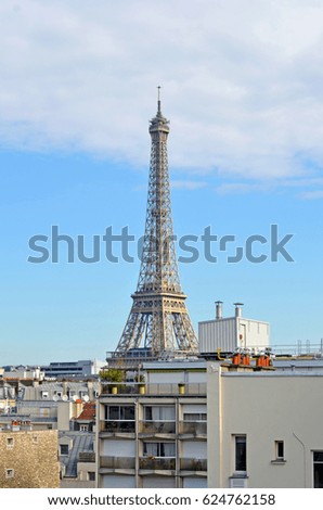 The iconic Eiffel Tower in Paris on a sunny summer day