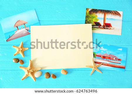 Travel concept. Composition with blank notepad page and cute decorations on wooden background