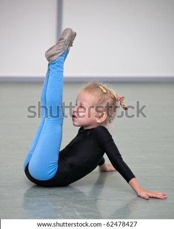 little gymnast girl in gym