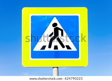 Road sign Pedestrian crossing against the blue sky background